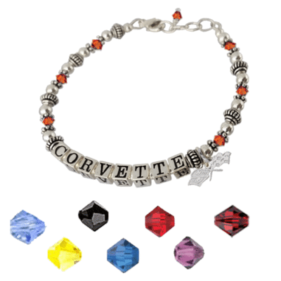Silver bracelet with "CORVETTE" beads, flanked by red crystals and silver spacers.