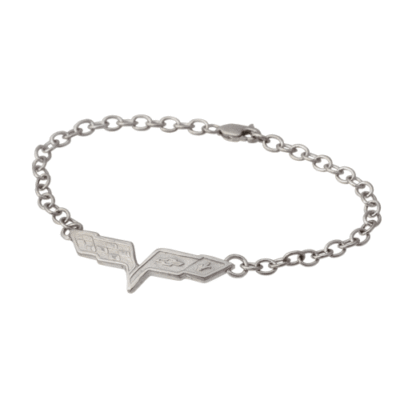 Silver chain bracelet featuring a zigzag-shaped pendant with engraved designs. Simple, elegant accessory on a plain white background.