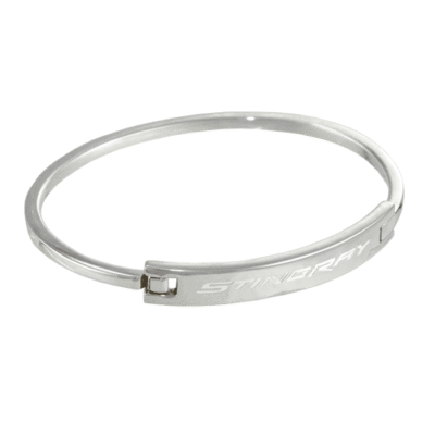 Silver stainless steel bangle bracelet with 'STINGRAY' engraved in uppercase letters on the flat center plate