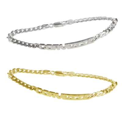 Two delicate chain bracelets, one in silver and one in gold, each with a small rectangular element featuring the word "GRATITUDE." Simple and elegant design.