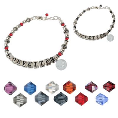 Silver bracelets with "Corvette" letter beads, surrounded by red and silver accents. Below are gemstones in various colors, creating a vibrant display.