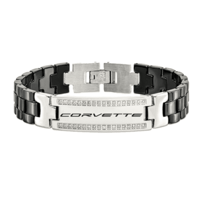 A sleek metal bracelet with the word "Corvette" engraved, featuring a mix of silver and black links, adorned with small sparkling stones.