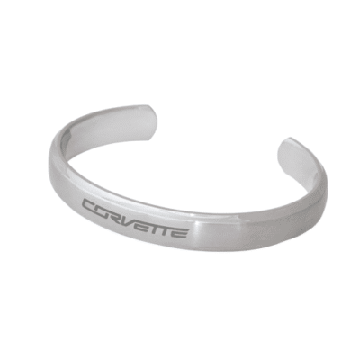 Silver stainless steel cuff bracelet engraved with 'CORVETTE ' in uppercase letters.