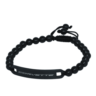 Black beaded adjustable bracelet with 'CORVETTE' engraved on a matte black rectangular plate, featuring black spherical beads and drawstring cord closure