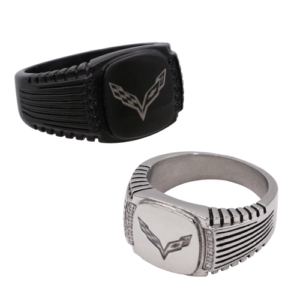 Two sleek bands are displayed: one black and one silver, each with an engraved emblem resembling wings. The design conveys a modern, bold aesthetic.